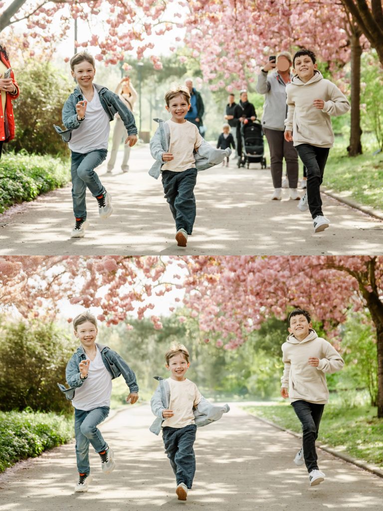 Kinder laufen fröhlich unter blühenden Kirschbäumen